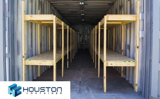 A row of wooden shelves in an enclosed container.