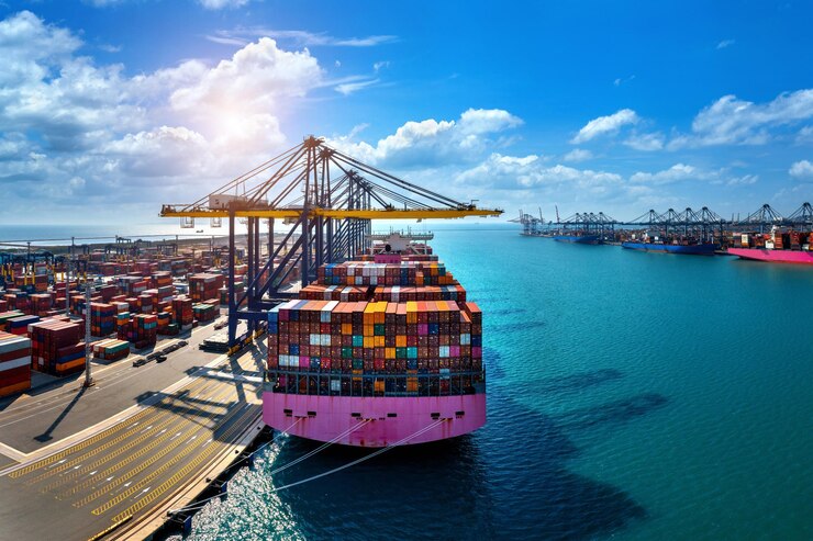 A massive cargo ship rests at port, ready to transport shipping containers filled with goods across the sea. Discover the reasons for using containers for storage!