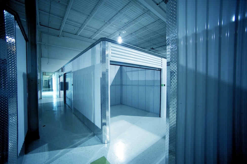 A spacious storage unit with an open door, ideal for renting storage containers.